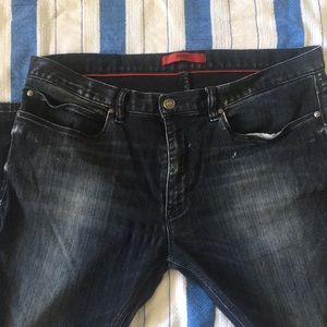 Men’s Hugo Boss black wash distressed jeans.